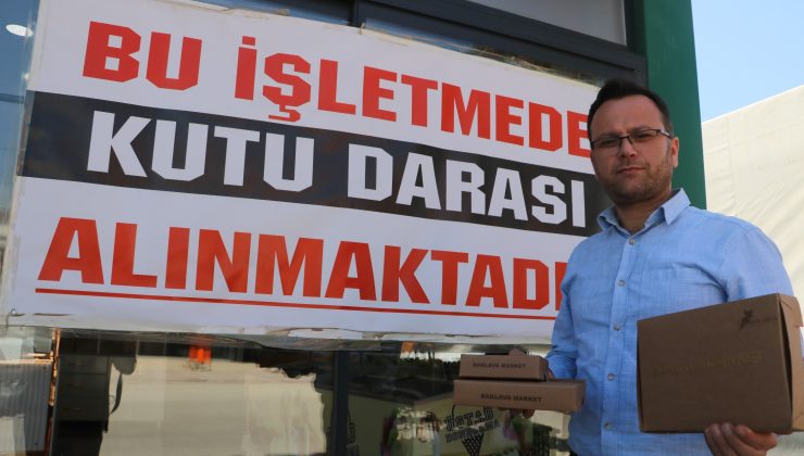 BAKLAVA SATIŞI YAPAN FİRMA KUTU DARASI TARTIŞMASINA 21 ŞUBESİNE ASTIĞI PANKARTLA SON VERDİ   