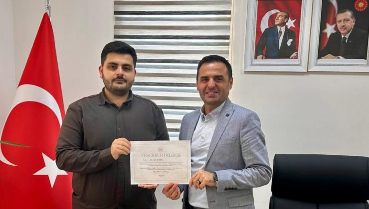 MÜDÜR COŞGUN BELGE TAKDİM ETTİ